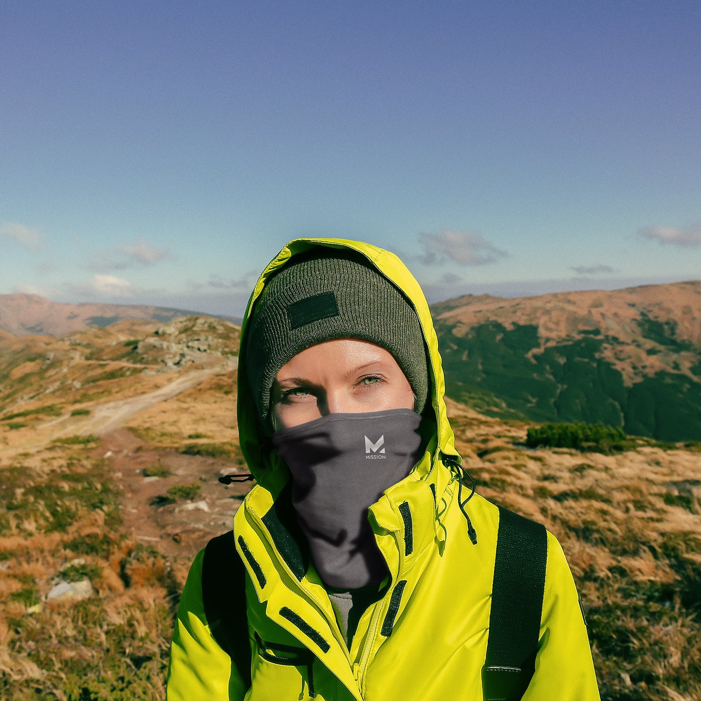 A woman in the Mission's sportswear in the mountains